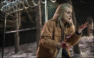 Taylor Schilling in a scene from ‘‍Orange is the New Black.’ The second season of the prison series became available Friday on Netflix. 