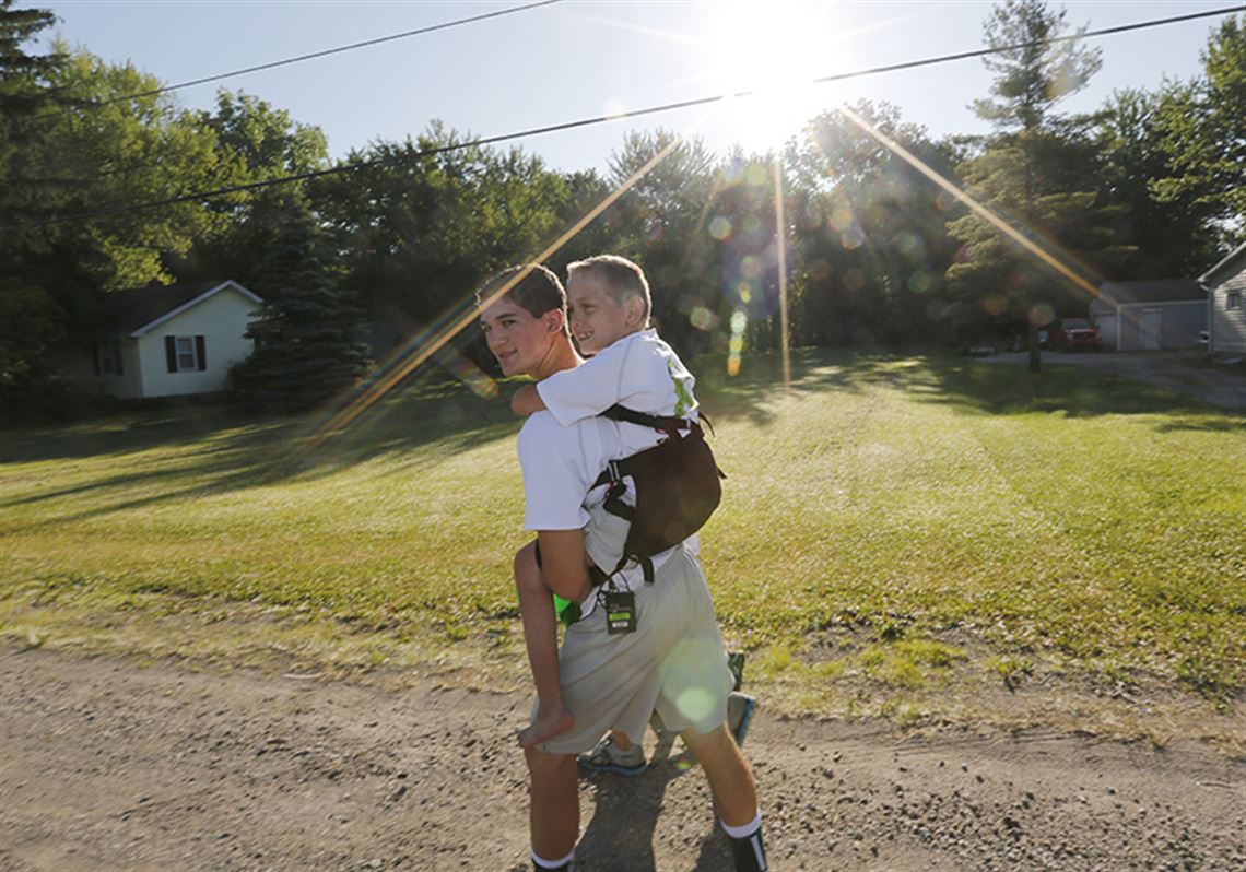 Brothers embark on piggyback ride to Ann Arbor The Blade pic