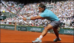 Nadal improved his record at Roland Garros to 66-1, and stretched his winning streak at the clay-court major to 35 straight.