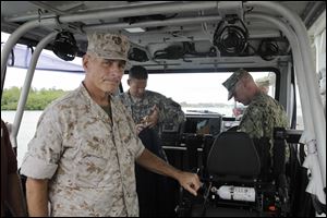 Marine Gen. John F. Kelly, the commander of U.S. Southern Command, arrives at the U.S. Navy base in Guantanamo Bay, Cuba, to visit with troops and meet with officials amid a fierce outcry in Washington over the recent exchange of five Taliban prisoners held at Guantanamo for a captured U.S. soldier.