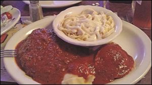 The combo plate at Jo-Jo's includes chicken Parmesan.