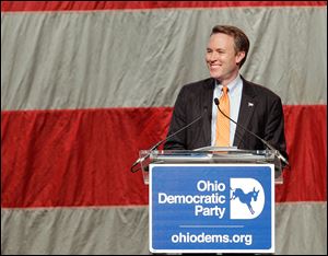 Ohio gubernatorial candidate Ed FitzGerald speaks at the Ohio Democratic Party annual fund-raising dinner Friday in Columbus. He urged those in the crowd to emerge from the dinner as a united, exuberant party. 