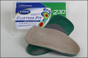 A pair of Dr. Scholl's custom fit orthotic inserts.
