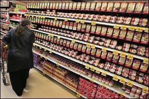 A shopper walking down the canned soup aisle at a grocery store in Cincinnati. Food companies and restaurants could soon face government pressure to make their foods less salty.