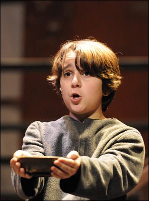 George Mancy, 12, of Ottawa Hills plays Oliver in the Croswell production of ‘‍Oliver!’