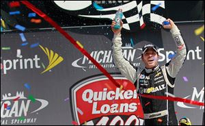 Jimmie Johnson celebrates his Quicken Loans 400 victory at Michigan International Speedway.
