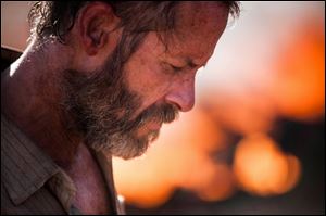 Guy Pearce portrays Eric as understated, yet menacing in ’The Rover.’