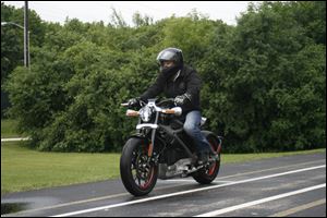 Employee Ben Lund demonstrates Harley's new electric motorcycle at Harley's research facility in Wauwatosa, Wis. 