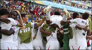 Costa Rican players celebrate after Bryan Ruiz scored his side's first goal during the group D World Cup soccer match between Italy and Costa Rica today at the Arena Pernambuco in Recife, Brazil.