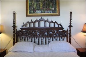 The headboard over the master bed (two twins pushed together) in author Ernest Hemingway's former Key West, Fla., home is actually a gate from a Spanish monastery.