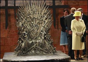 Britain's Queen Elizabeth visits the throne room at the set of the Game of Thrones TV series in  Titanic Quarter, in Belfast Northern Ireland.