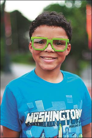 Zachriah Burch, 11, sports his Space Invaders inspired exhibit glasses.