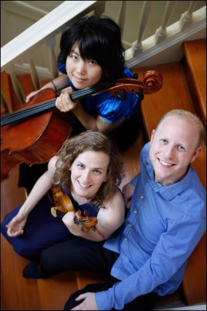 The Delphi Trio — Michelle Kwon, top, Liana Berube, and Jeffrey LaDeur — will perform at 8 p.m. Friday at Kerrytown Concert House in Ann Arbor.