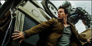 Mark Wahlberg, front, as Cade Yeager, and Lockdown, rear, in a scene from the the film.