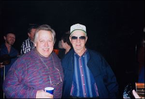 In this undated photo provided by Lindy McKim, country music singer John Conlee, left, poses with fan Paul Eckhart at the Opry House, in Nashville, Tenn. 