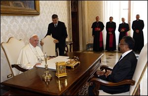 Pope Francis, left, meets with President of Madagascar Hery Rajoanarimampianina, right, today at the Vatican.