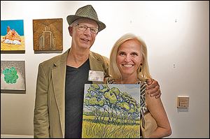 Artist Jeff Anderson chats with Deb Calabrese during the Arts Undisclosed fund-raiser.