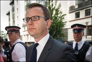 Former News of the World editor Andy Coulson arrives at the Old Bailey court to be sentenced,  in London,  today. Coulson, 46, has been found guilty of being involved in the conspiracy to hack into the phone voicemails of many celebrities, royals, politicians and ordinary members of the public, at the now-closed British Sunday tabloid newspaper.