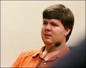 A tear rolls down the cheek of Justin Ross Harris, the father of a toddler who died after police say he was left in a hot car for about seven hours, as he sits during his bond hearing in Cobb County Magistrate Court, Thursday in Marietta, Ga.