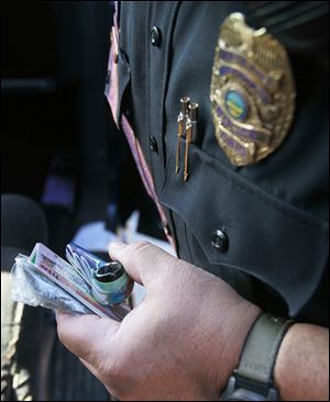 Drug paraphernalia is recovered during the drug-enforcement sweep in Wood County. Officers issued two drug-related citations in the 8-hour period. The officers working the enforcement detail split into two teams, dividing the city and doing focused patrols.