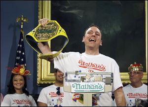 Seven-time hot dog eating champion, Joey Chestnut, weighs in Thursday. He won today's July 4 competition.