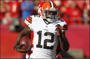 In this Oct. 27, 2013, photo, Cleveland Browns wide receiver Josh Gordon (12) runs during an NFL football game against the Kansas City Chiefs in Kansas City, Mo. Police say Gordon was arrested and charged with driving while intoxicated after speeding down a street in Raleigh, N.C. Police spokesman Jim Sughrue said Gordon was taken into custody after being pulled over for going 50 mph in a 35 mph zone on U.S. 70 in northwest Raleigh around 3 a.m. Saturday, July 5, 2014. Gordon was released on bail. (AP Photo/Colin E. Braley)