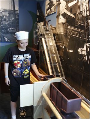 Ashton Short, 10, of Rochester Hills, Mich., said he examined many of the interactive exhibits the Great Lakes museum offers.