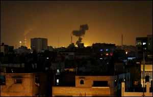 Smoke rises after an Israeli missile strike in Beit Lahia on Monday in northern Gaza Strip.