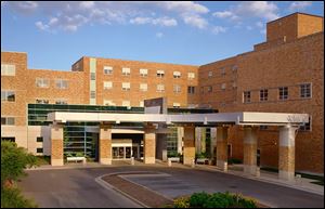 Mercy Memorial Hospital in Monroe says it is looking to cut costs by joining a large health-care system. ProMedica has other hospitals in Michigan.