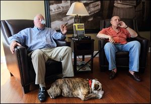 John Henry, left, and Dave Webb, two of the co-owners of  Third Street Cigar, sit back and enjoy a quiet moment at their Waterville store in their dogged pursuit of a place for fellow aficionados.