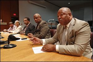Toledo councilmen, from left, Mike Craig, Theresa Gabriel, Jack Ford, Larry Sykes, and Tyrone Riley, speak out against recent gun violence during a news conference at One Government Center in Toledo on Thursday.