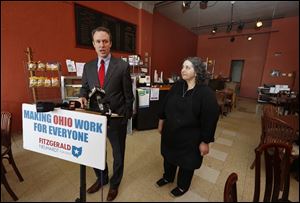 Ed FitzGerald, Democratic candidate for Ohio governor,  with Jackie David, speaks to the media at the Original Sub Shop on Broadway today in Toledo.  Jackie and husband Sargis David own the shop.