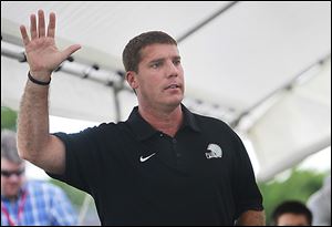 Chris Ash, Ohio State’s new defensive co-coordinator, tells his audience at Perrysburg Junior High to embrace one of his 10 points and ‘‍live it.’