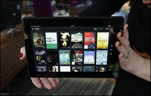 Amazon is rolling out a new subscription service that will allow unlimited access to thousands of electronic books and audiobooks for $9.99 a month in the online giant's latest effort to attract more users.
