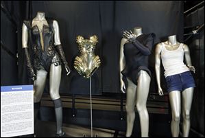 From left, outfits from Beyonce's 2013 Super Bowl performance, 2011