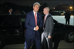 Secretary of State John Kerry steps out of his vehicle early Monday to board his plane at Andrews Air Force Base as he begins his trip to the Middle East.