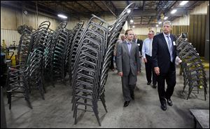 Michigan Lt. Gov. Brian Calley, left, goes on a tour of MTS Seating in Temperance with company's president, Barton S. Kulish.