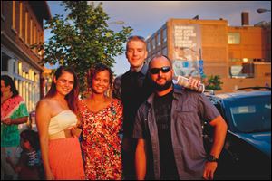 From left, Angie Edwards, Tierra McKinney, Joe Oberster, and Wayne Henderson, stand outside Manhattanâs at the SoundTrek music festival.  