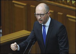Arseniy Yatsenyuk announced his resignation Thursday, a move that opens the way for new elections that would reflect a the country’s starkly changed political scene after the ouster of pro-Russian President Viktor Yanukovych in February.