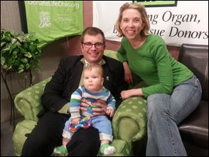 Jeff Abke, with his wife Rachel Abke and son Wally during a green chair sit-in in April to celebrate organ and tissue donation month.