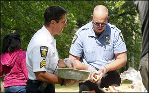 Toledo Police Department Sgt. Greg Mahlman, left, and Officer Mike Habbe, right.