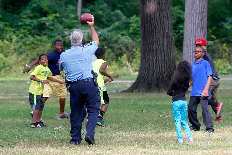 CTY-picnic29p-Officer-Jim-Below-football