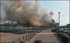 A fire has broken out on Eastbourne Pier, East Sussex, England, Wednesday, July 30, 2014. 
