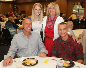 The Gibbs family during the Marathon Classic Volunteer party, from left, Jim, Taylor, Carol, and Dylan, 16.