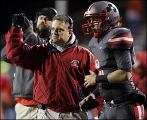 Central Catholic Greg Dempsey fires up his team against Clyde during a Division III regional final football playoff game last November at Doyt Perry Stadium in Bowling Green