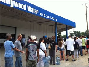 Scenes like this were common this morning as area residents traveled all over in search of bottled water.