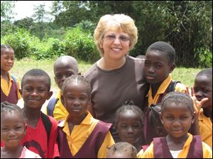 Nancy Writebol with children in Liberia in October, 2013. Writebol is one of two Americans working for a missionary group in Liberia that have been diagnosed with Ebola. 