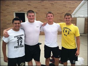 Perrysburg High School football team captains are, from left, lineman Michael Bogdanski, lineman Cale Bonner, quarterback and defensive back Gus Dimmerling, and wide receiver and defensive back Quinn Thomas. 