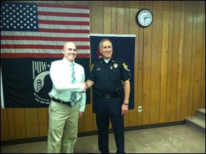 Andy Gerdeman, left, was hired as a police patrolman.