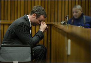 Oscar Pistorius, gestures, as he sits in court, during his trial in Pretoria, South Africa, today. The chief defense lawyer for Oscar Pistorius delivered final arguments in the athlete's murder trial today.